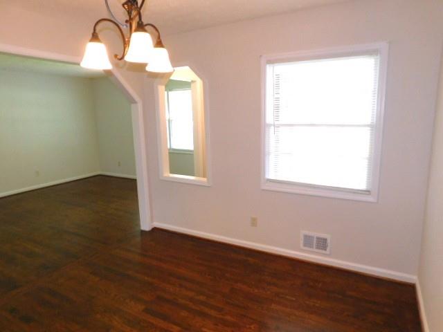 879 Forest Ridge Drive Southeast Marietta, GA 30067 - Photo 7 of 29 wooden floor in an empty room with a window
