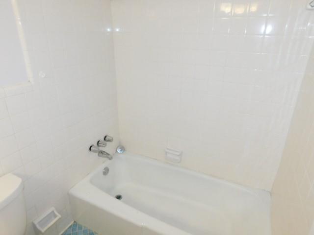 879 Forest Ridge Drive Southeast Marietta, GA 30067 - Photo 10 of 29 a white bath tub sitting next to a white toilet