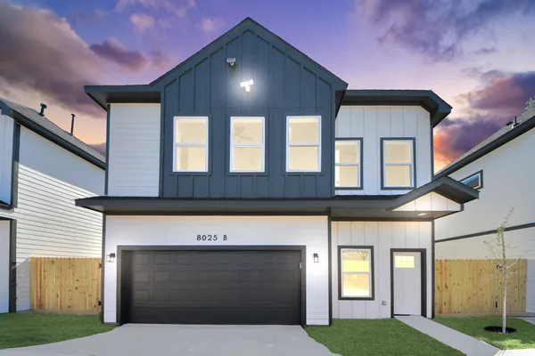 a front view of a house with a garage