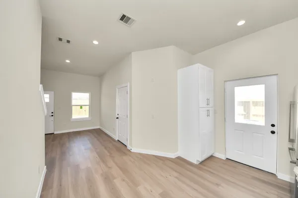 a kitchen with stainless steel appliances a stove microwave and sink