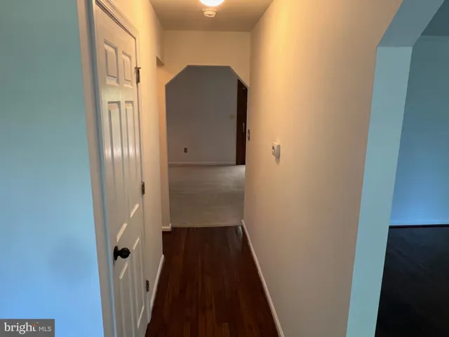 a view of a livingroom with furniture and an entryway