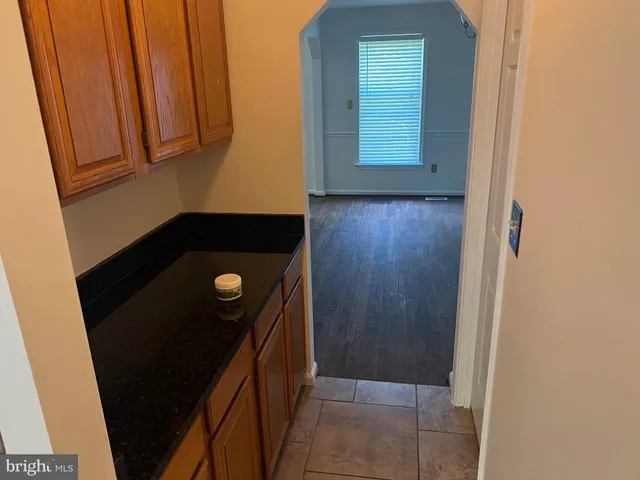 a view of empty room with window and fireplace
