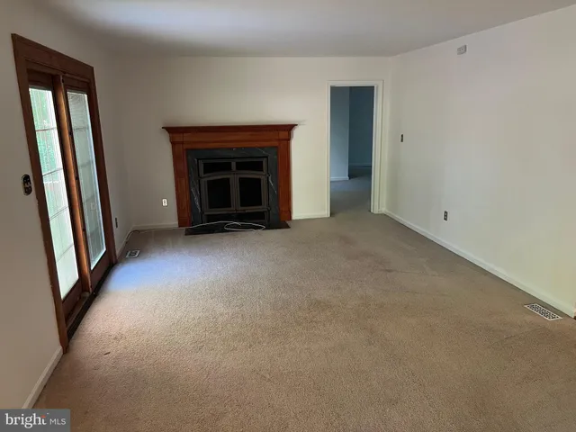 a bathroom with a granite countertop shower and a toilet