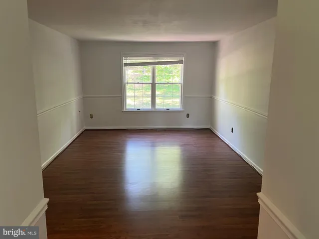 a bathroom with a granite countertop shower and a toilet