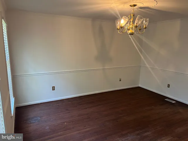 a white toilet sitting next to a shower