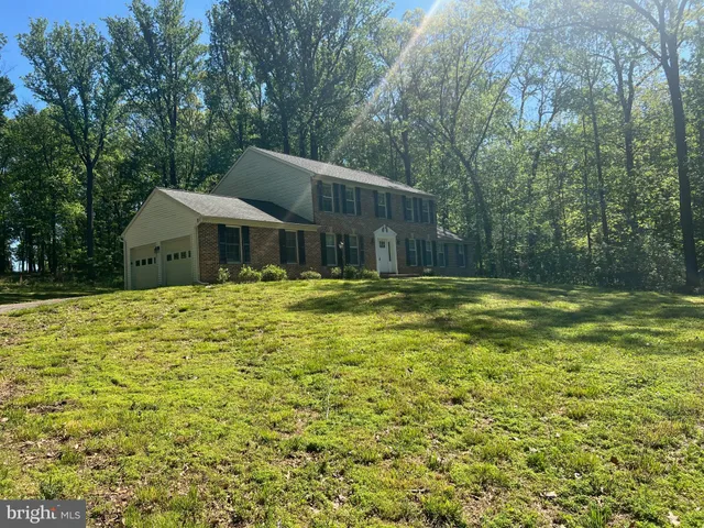 a house with swimming pool in front of it