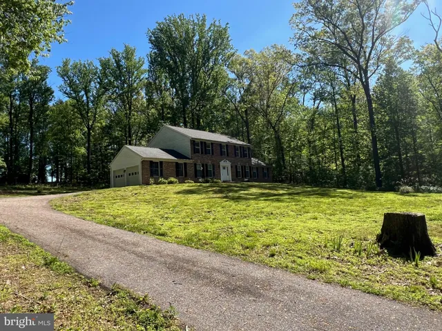 a house with swimming pool in front of it