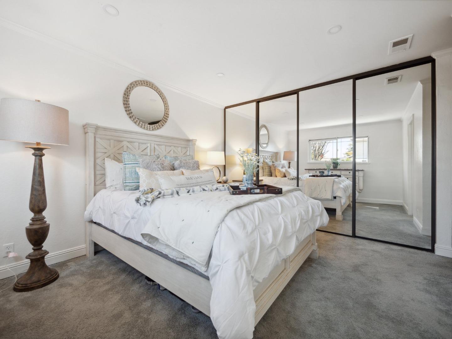 205 Evergreen Way Milpitas, CA 95035 - Photo 15 of 31 a large bed sitting in a room next to a window