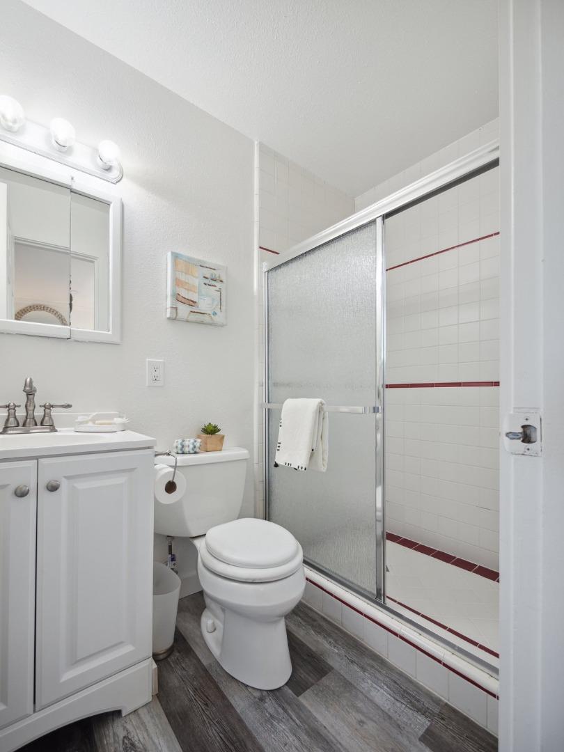 205 Evergreen Way Milpitas, CA 95035 - Photo 20 of 31 a bathroom with a toilet a sink and shower