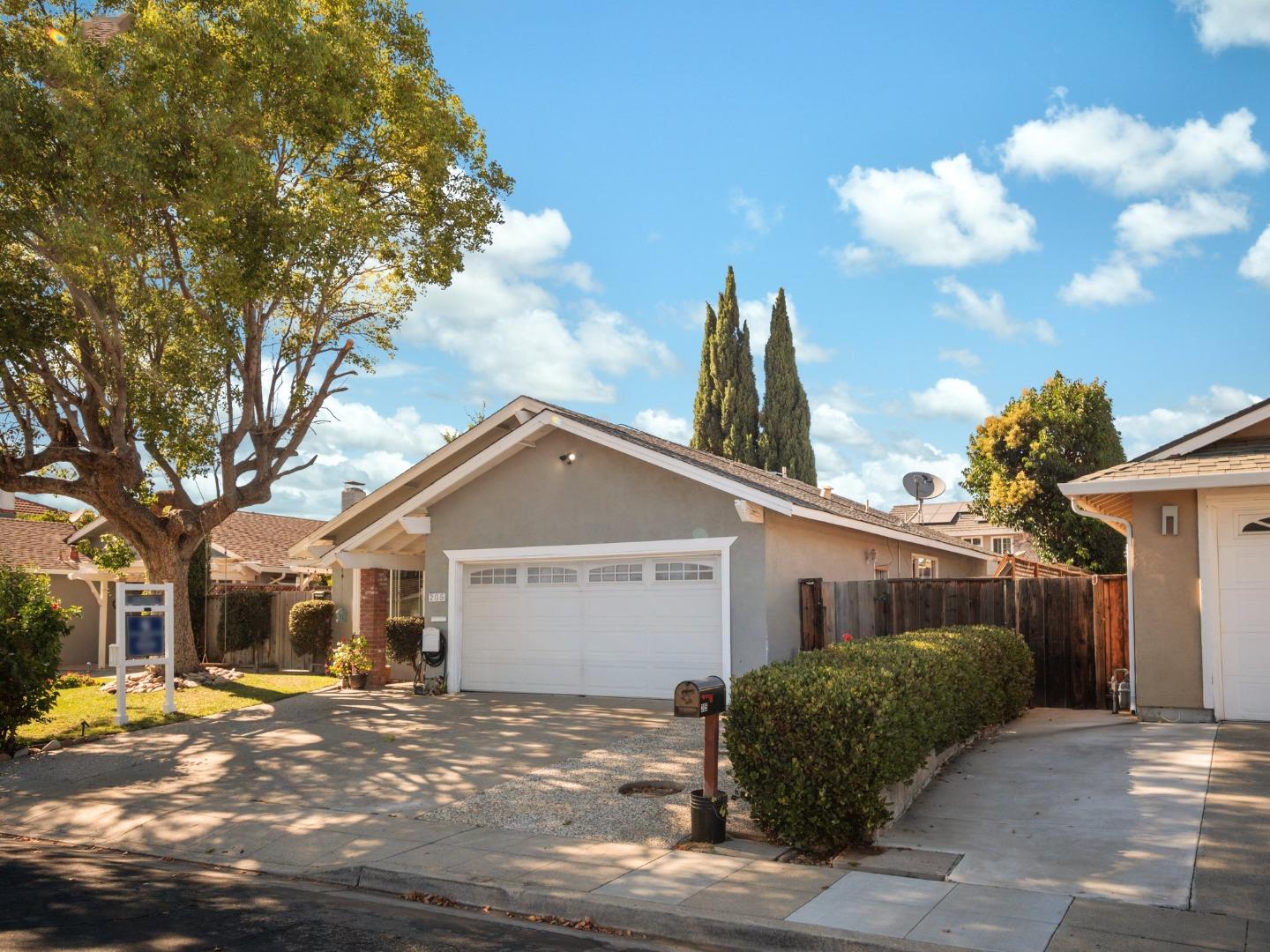 205 Evergreen Way Milpitas, CA 95035 - Photo 2 of 31 a front view of a house with a yard and garage