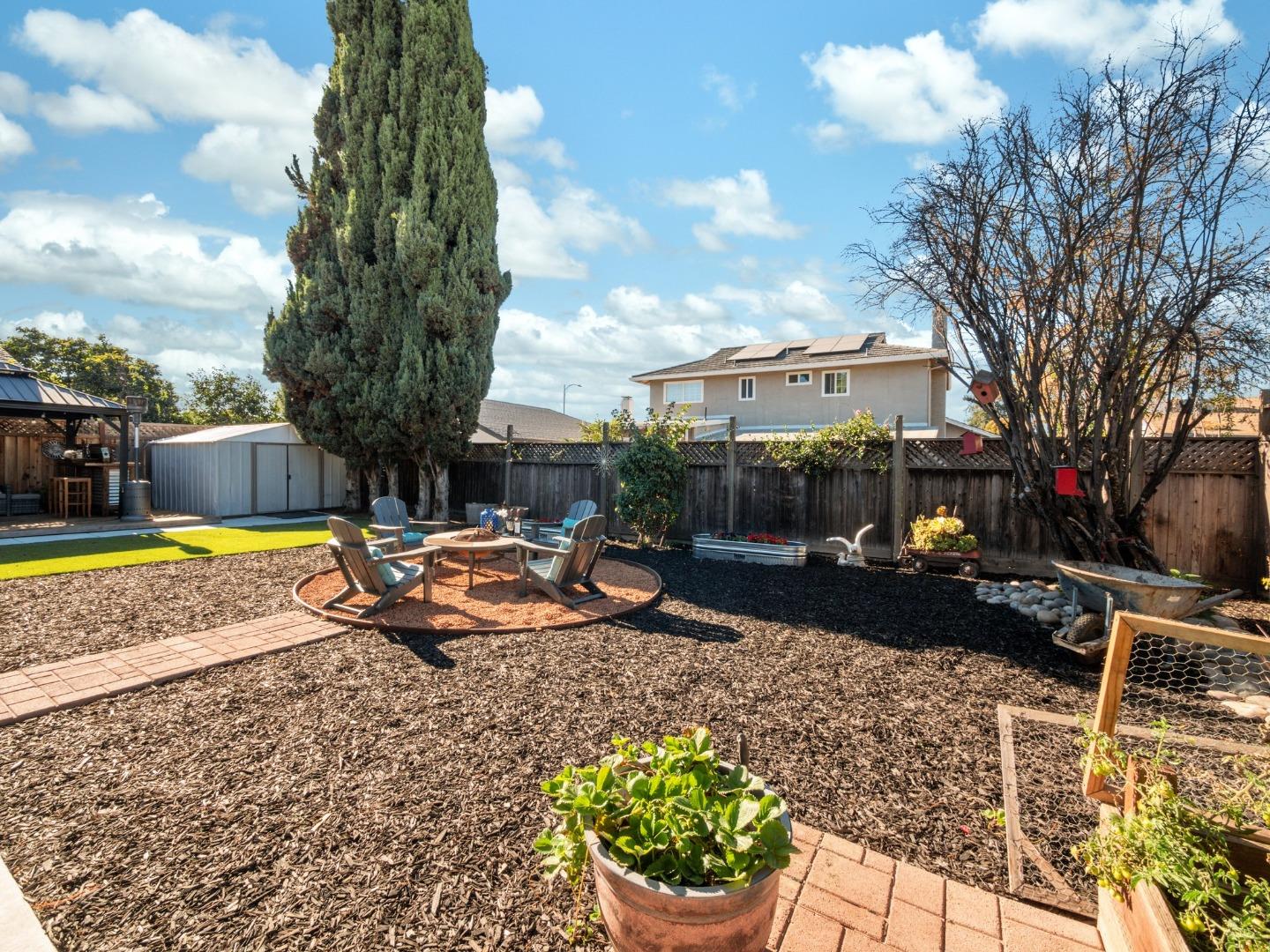 205 Evergreen Way Milpitas, CA 95035 - Photo 27 of 31 a view of a swimming pool with sitting area and garden