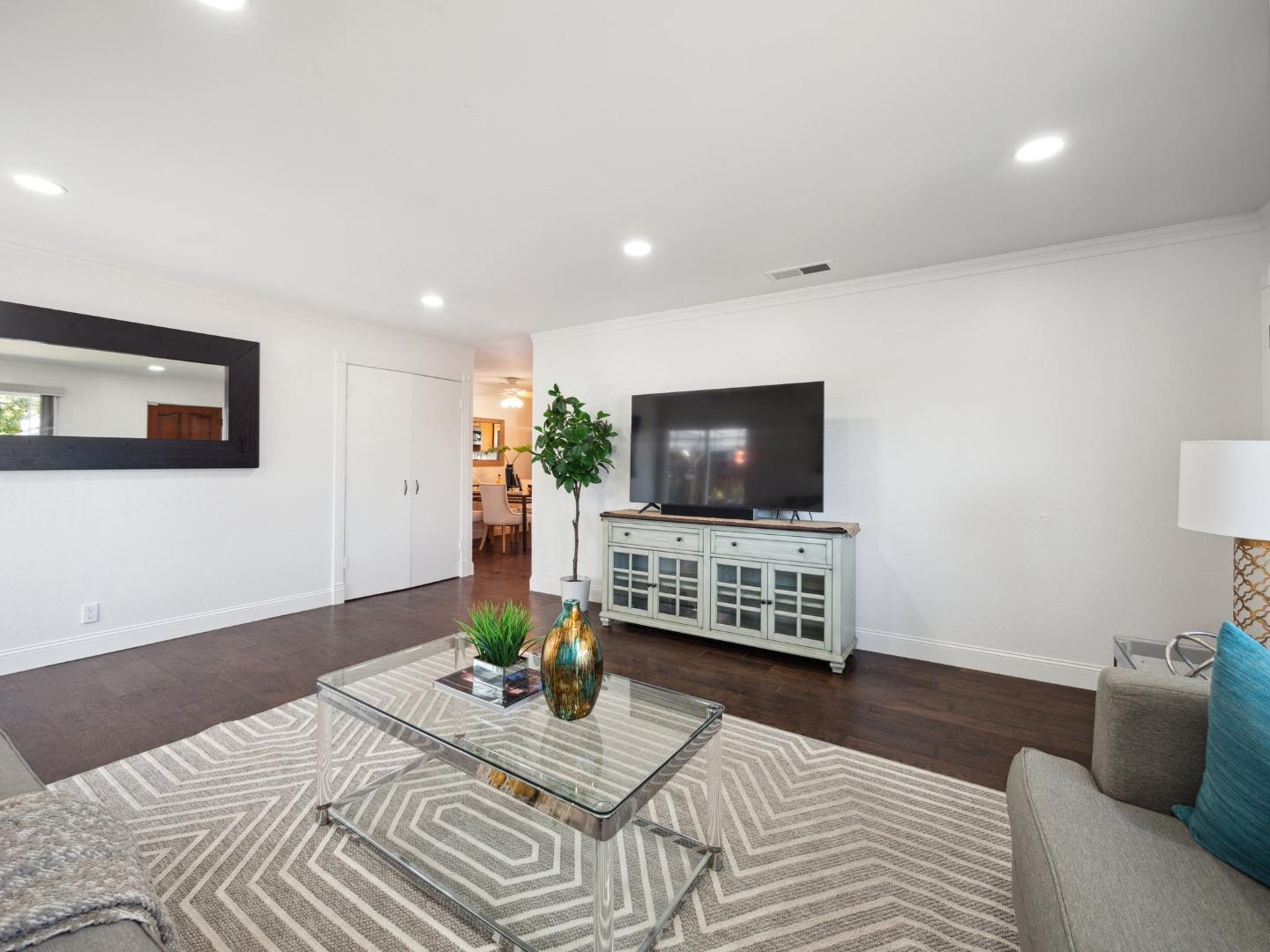 205 Evergreen Way Milpitas, CA 95035 - Photo 7 of 31 a living room with furniture and a flat screen tv