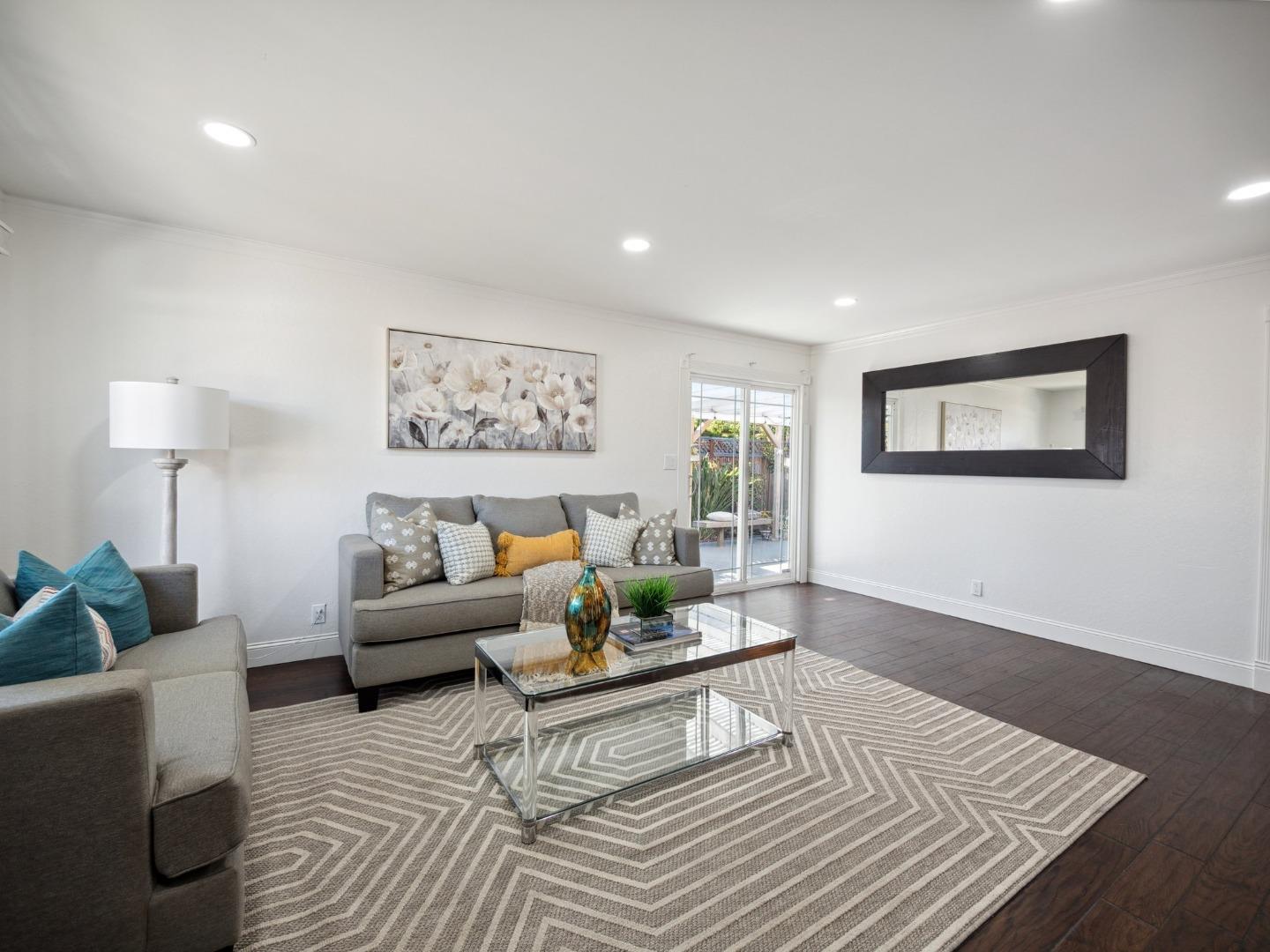205 Evergreen Way Milpitas, CA 95035 - Photo 8 of 31 a living room with furniture and a wooden floor