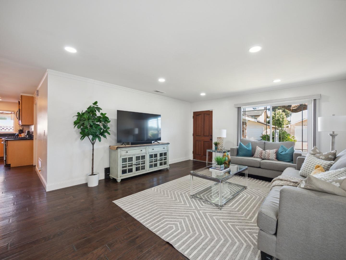 205 Evergreen Way Milpitas, CA 95035 - Photo 10 of 31 a living room with furniture and a flat screen tv
