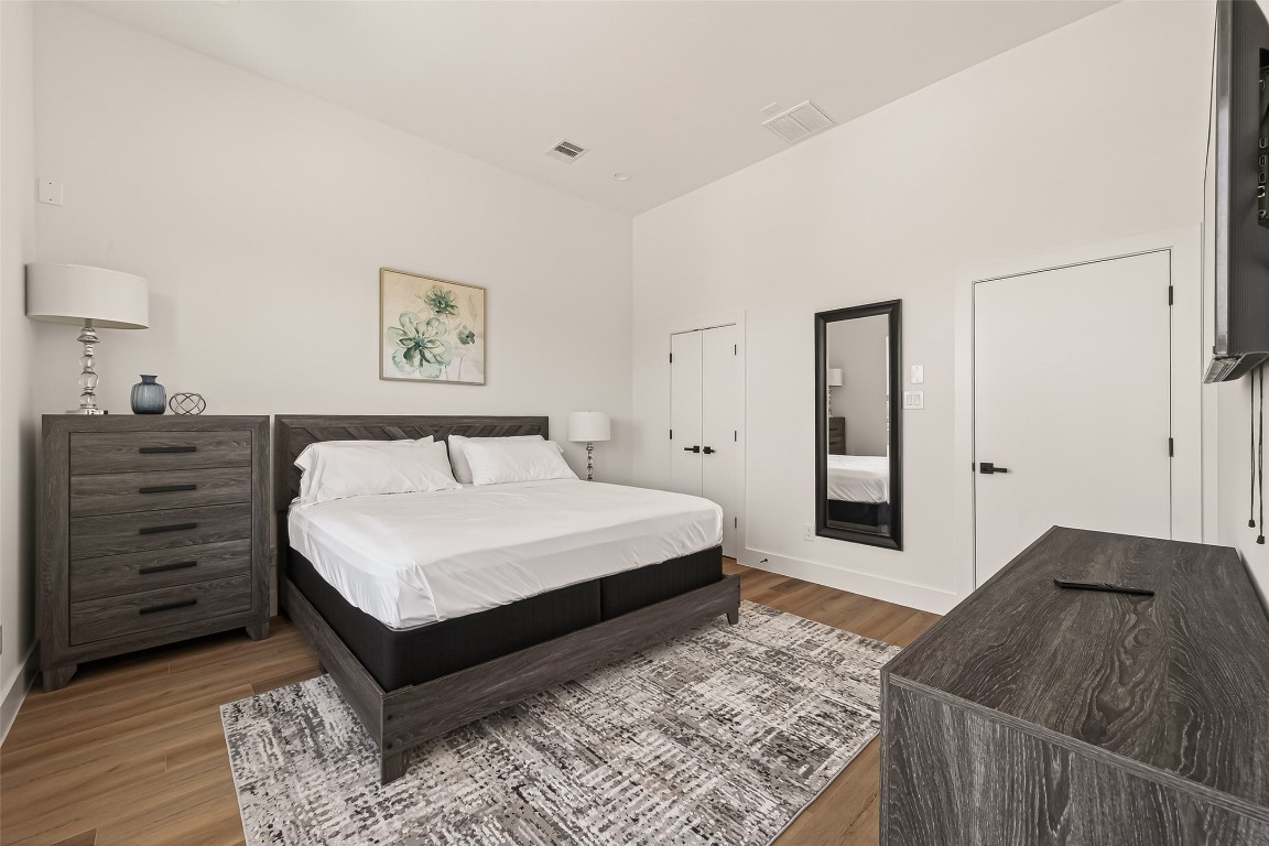 3402 Luca Street Houston, TX 77021 - Photo 13 of 18 a bedroom with a bed and a dresser