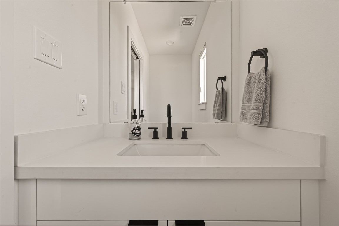 3402 Luca Street Houston, TX 77021 - Photo 8 of 18 a bathroom with a sink and a mirror