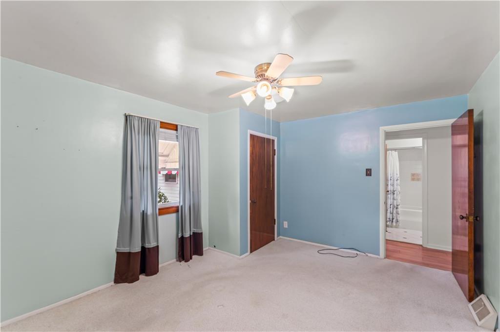 9 McElree Road Washington, PA 15301 - Photo 11 of 32 a view of a room with a ceiling fan and closet