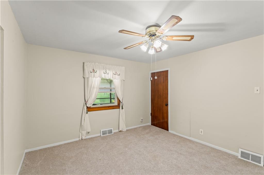9 McElree Road Washington, PA 15301 - Photo 12 of 32 an empty room with windows and fan