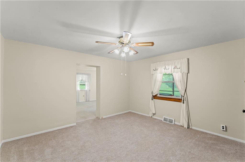 9 McElree Road Washington, PA 15301 - Photo 13 of 32 an empty room with windows and ceiling fan
