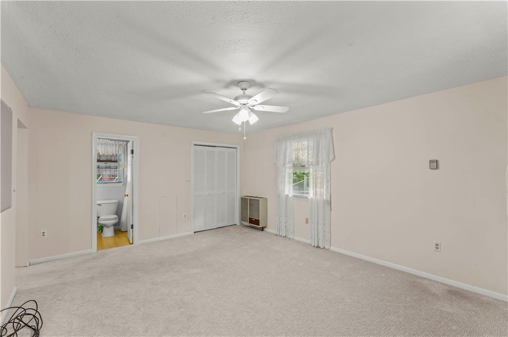 9 McElree Road Washington, PA 15301 - Photo 17 of 32 an empty room with closet and windows