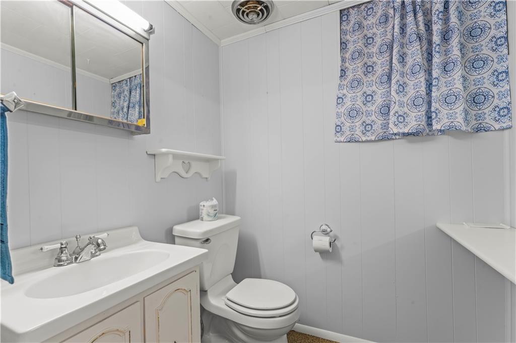 9 McElree Road Washington, PA 15301 - Photo 22 of 32 a bathroom with a toilet sink and mirror