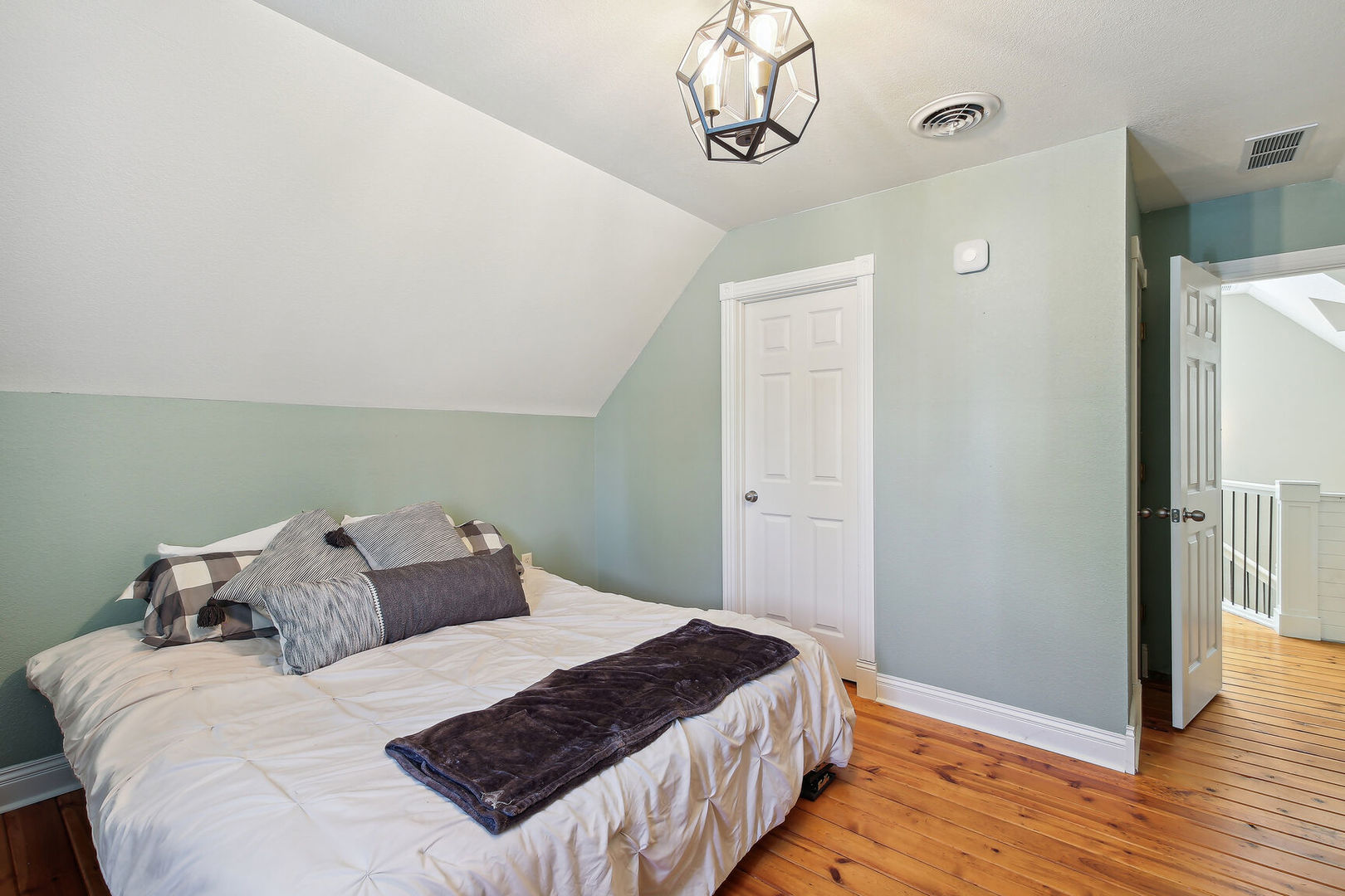 664 North Macon Street Bement, IL 61813 - Photo 13 of 24 a bedroom with a bed and wooden floor