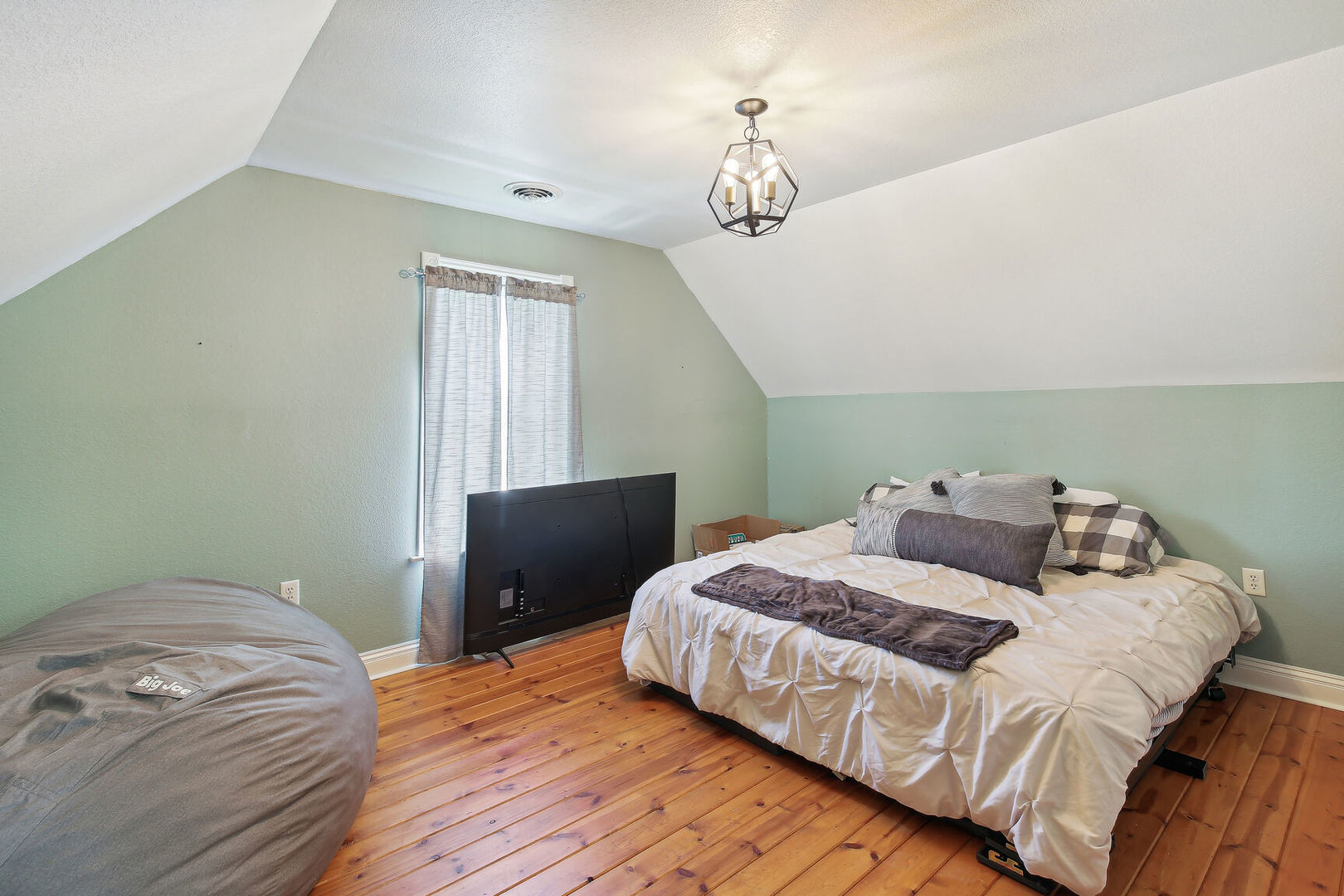 664 North Macon Street Bement, IL 61813 - Photo 14 of 24 a bedroom with a bed and window