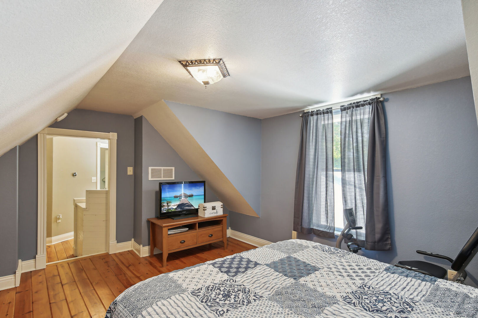 664 North Macon Street Bement, IL 61813 - Photo 16 of 24 a bedroom with a bed and a large window with outer view