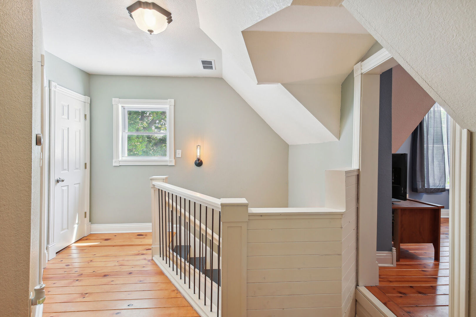664 North Macon Street Bement, IL 61813 - Photo 18 of 24 a view of a hallway view with wooden floor and staircase