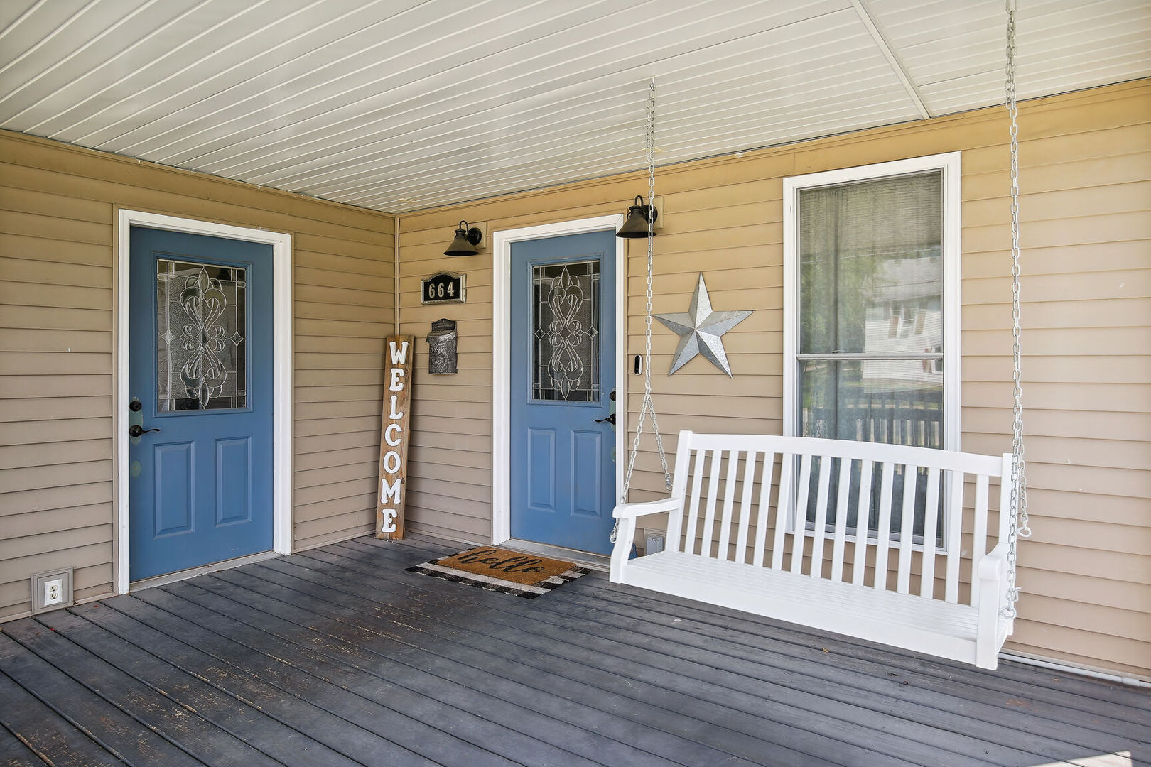 664 North Macon Street Bement, IL 61813 - Photo 5 of 24 an empty room with wooden floor and windows