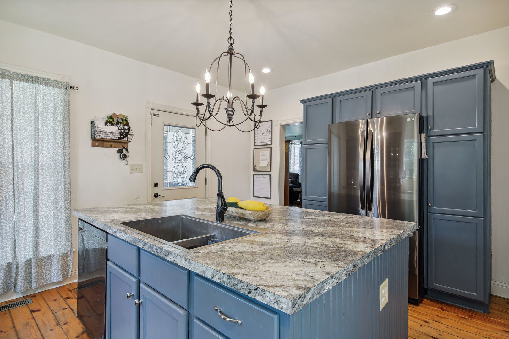 664 North Macon Street Bement, IL 61813 - Photo 9 of 24 a kitchen with stainless steel appliances granite countertop a sink refrigerator and microwave