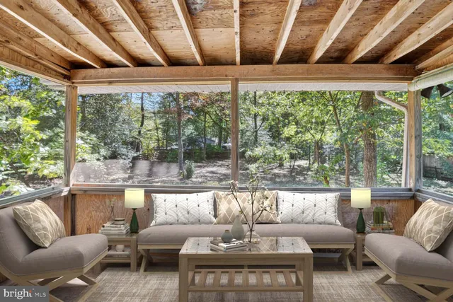 a picture of a bench in front of a window