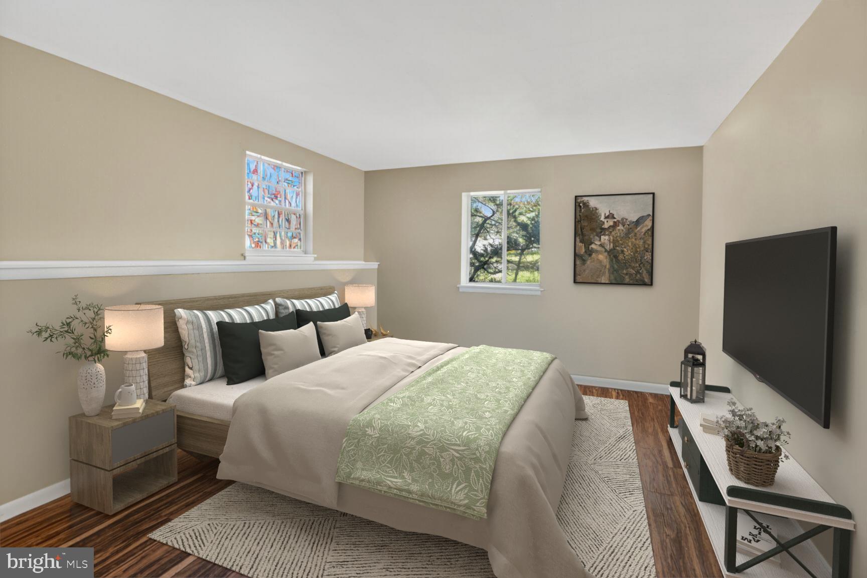 1527 Patuxent Manor Road Davidsonville, MD 21035 - Photo 17 of 36 a bedroom with a bed and a flat screen tv