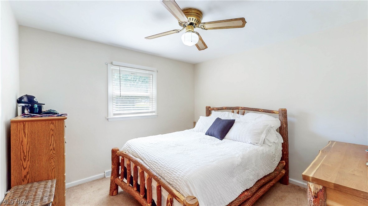 3659 Morrow Road Kent, OH 44240 - Photo 18 of 39 Bedroom featuring neutral wall paint, carpet flooring, a window with blinds, and a ceiling fan with integrated lighting