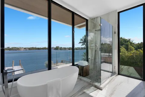a bathroom with a bathtub and shower