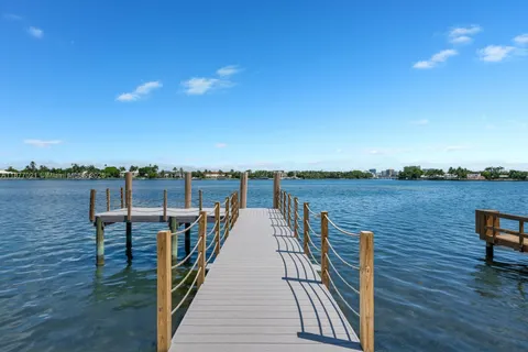 a view of a lake with sitting area