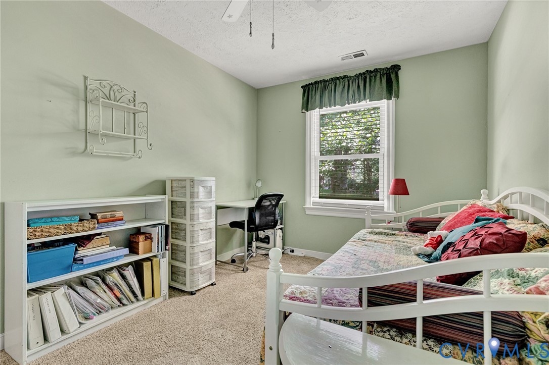3841 Strawhill Road Richmond, VA 23231 - Photo 36 of 56 Carpeted interior with light green walls, a single