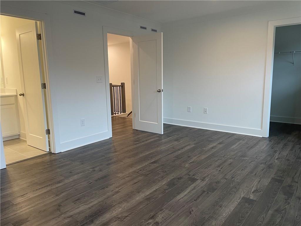 3391 Catalan Alley Avondale Estates, GA 30002 - Photo 15 of 18 an empty room with wooden floor and closet