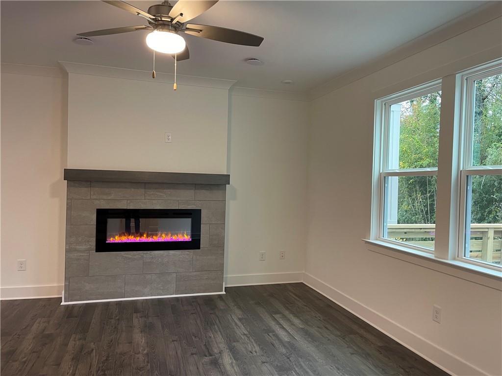 3391 Catalan Alley Avondale Estates, GA 30002 - Photo 17 of 18 an empty room with wooden floor chandelier and windows
