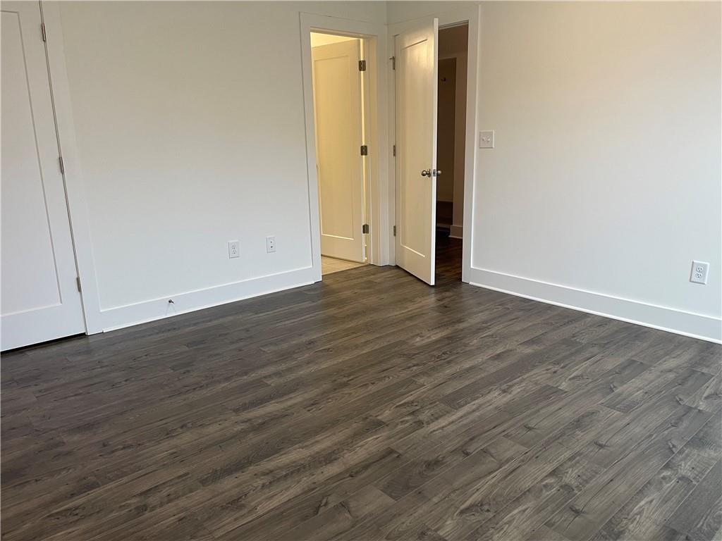 3391 Catalan Alley Avondale Estates, GA 30002 - Photo 18 of 18 an empty room with wooden floor and white doors