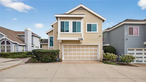 a front view of a house with a garage