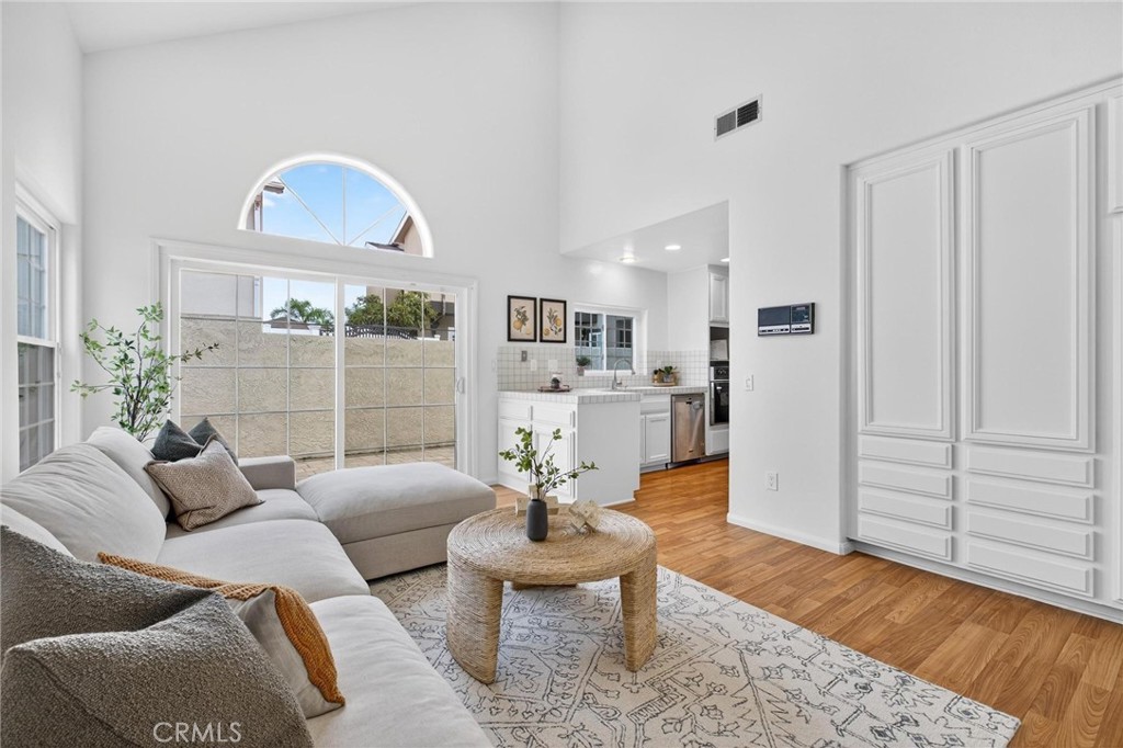 1714 Flower Avenue Torrance, CA 90503 - Photo 17 of 40 a living room with furniture a rug and a painting on the wall
