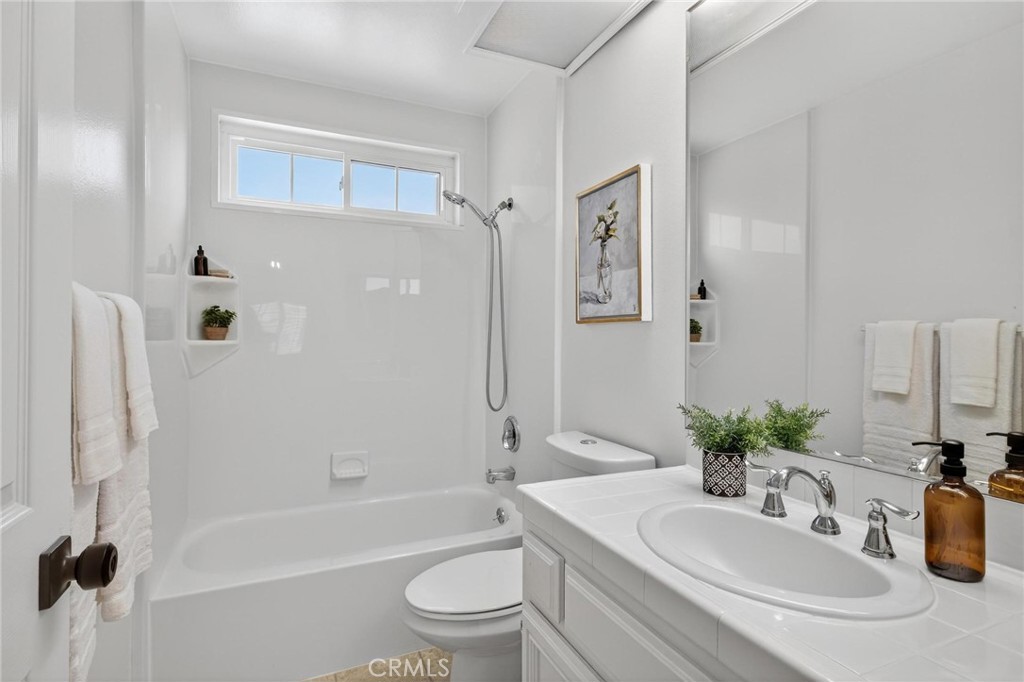 1714 Flower Avenue Torrance, CA 90503 - Photo 21 of 40 a bathroom with a granite countertop sink toilet and shower