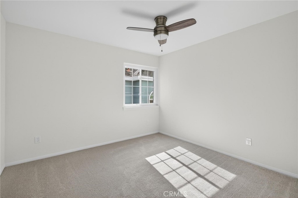 1714 Flower Avenue Torrance, CA 90503 - Photo 24 of 40 an empty room with windows and ceiling fan