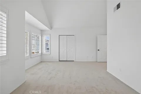 a bathroom with double sink and two mirror