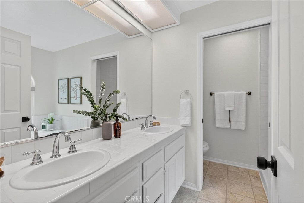 1714 Flower Avenue Torrance, CA 90503 - Photo 30 of 40 a bathroom with double sink and two mirror