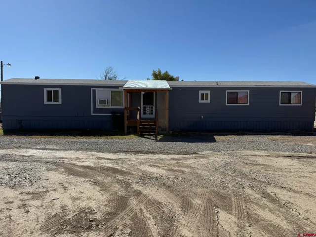 a house with trees in the background