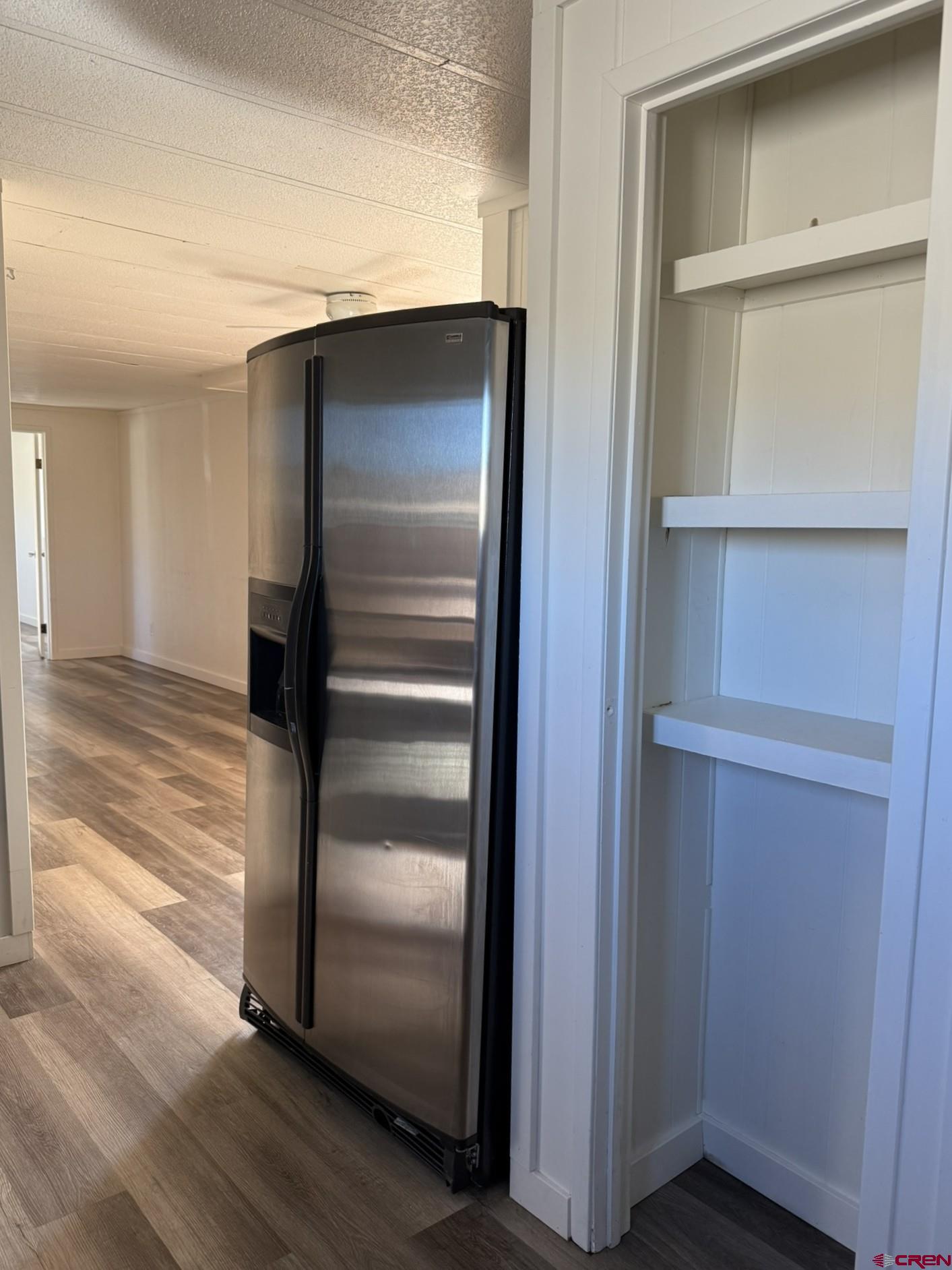 1205 Highway 50, Unit 24 Delta, CO 81416 - Photo 11 of 22 a room with wooden floor and closet
