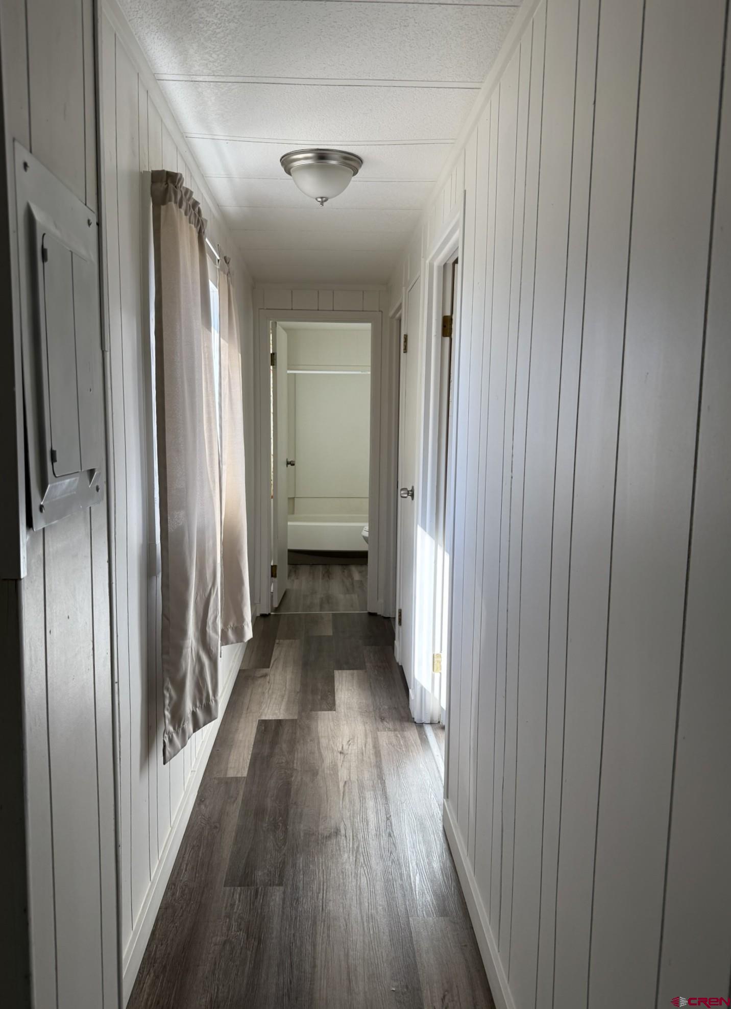 1205 Highway 50, Unit 24 Delta, CO 81416 - Photo 17 of 22 a view of a hallway with wooden floor