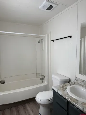 a view of a livingroom with wooden floor
